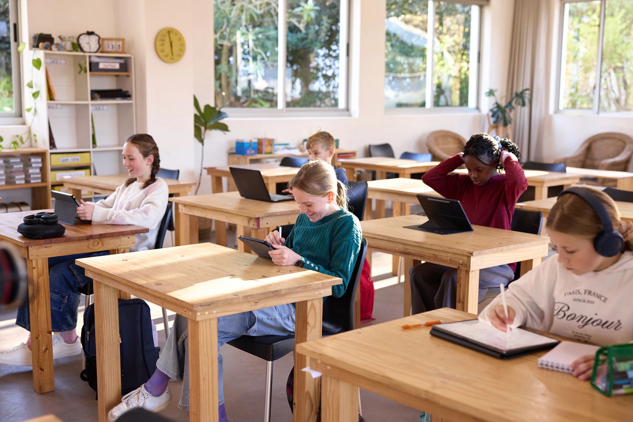 Students learning together in a bright classroom